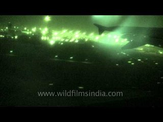 Flicker of neon green lights in Delhi city: view from aeroplane