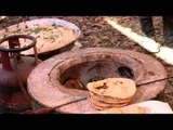 Roti being cooked in a tandoor