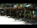 Villagers in Baktwang village breaking stones for road construction