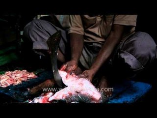 Cutting fish: Kolkata Durga puja