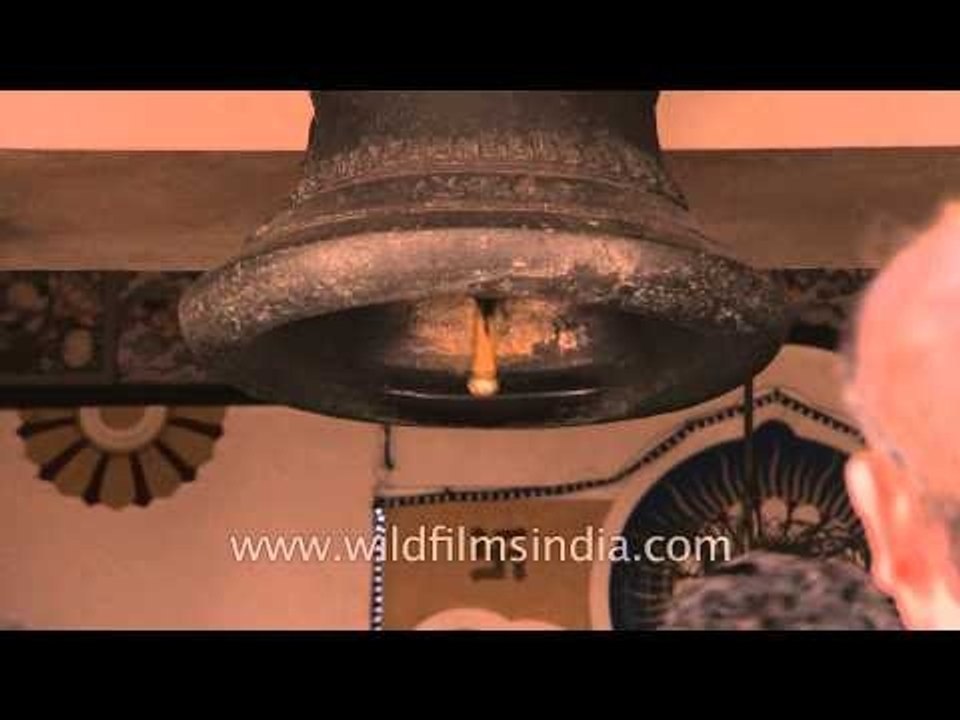 Devotees touching the temple's bell at Birla Mandir