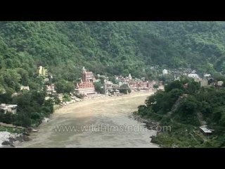 Large ashrams and fast flowing Ganga, Rishikesh