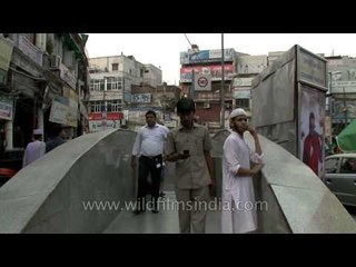People in quick motion at Chawri Bazar metro station