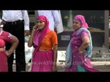 Plump women in sarees, at GTB Nagar Bus Stop, New Delhi