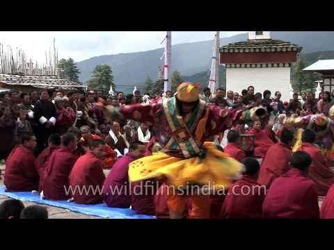 Monks swrils as they perform the ritual dance in Bhutan