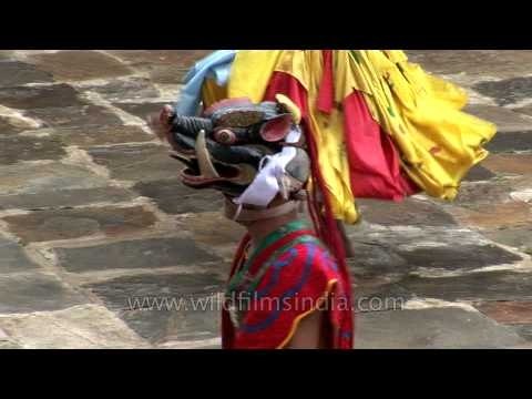 Monks covered in animal mask performs the ritual dance in Bhutan
