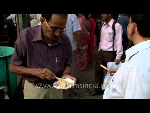 Old man enjoying Aloo Tikki at Chandni Chowk, Delhi