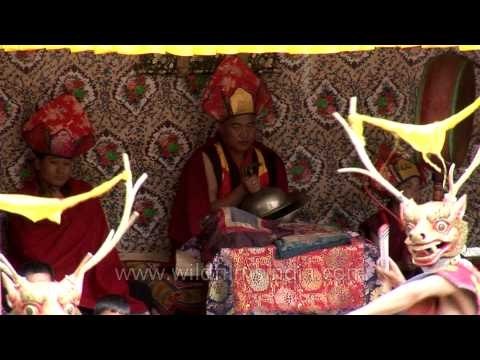 Cham dance accompained by music played using traditional Tibetian instruments
