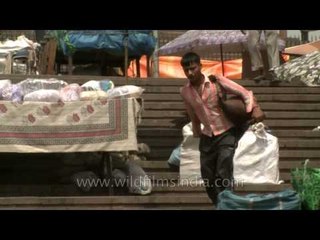 A Bhishti with his mashak in front of Jama Masjid at Chandni Chowk