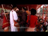 Devotees offering money to Sadhus at Samashti Bhandara during Maha Shivratri