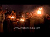 Holy crowd performs evening aarti at Allahabad Sangam during Maha Kumbh