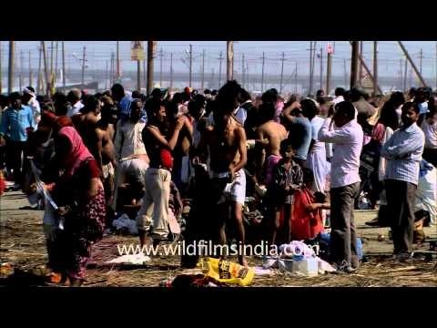 Devotees after holy bath in Ganga river at Maha Kumbh