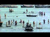 Devotees paying obeisance and taking holy dip in Sangam during Maha Kumbh