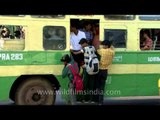 Traffic at Ripon building with Chennai bus travellers hanging out of bus
