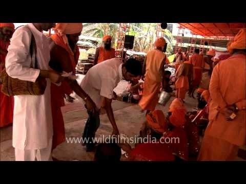 Devotees offering money to Sadhus at Samashti Bhandara during Maha Shivratri