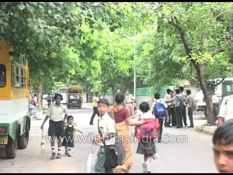 An auto-rickshaw overloaded with students