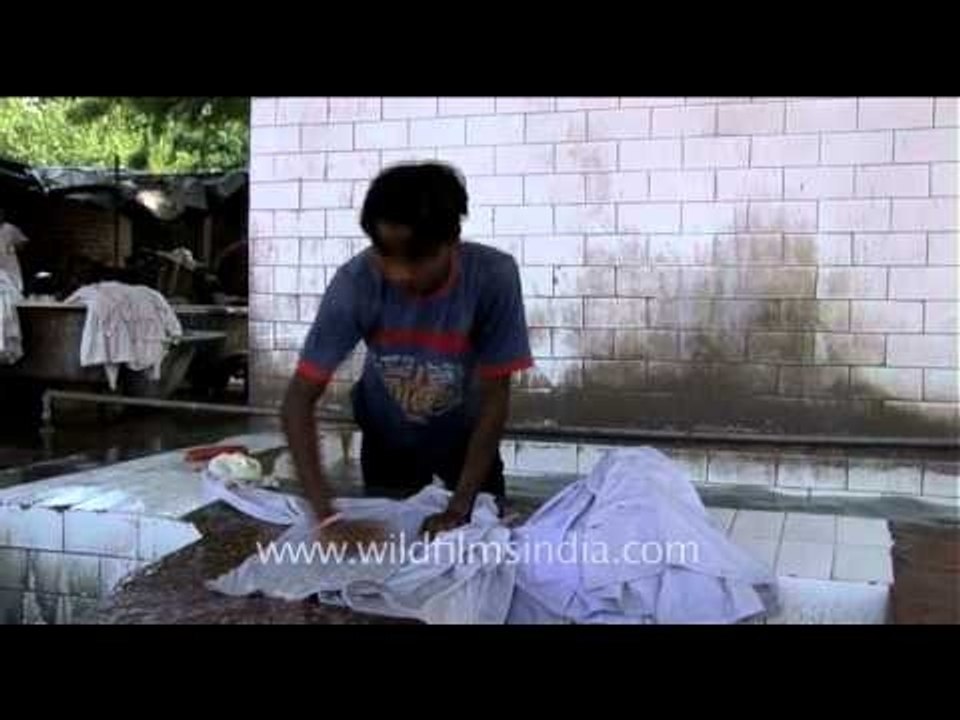 Washer man washing clothes in Dhobhi ghat