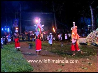 Ritualistic dance by masked Padayani performers in Kerala