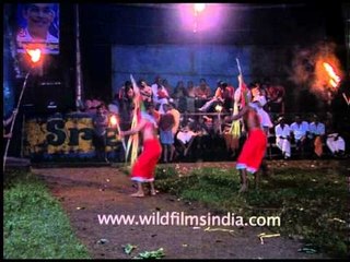 Artist wearing Mask or Kolams dancing at the Padayani Festivals in Kerala