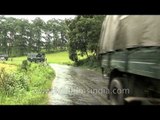 Vehicles on wet roads near Shillong Golf Course, Meghalaya