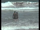 Couple having fun by the sea at Puri in Orissa