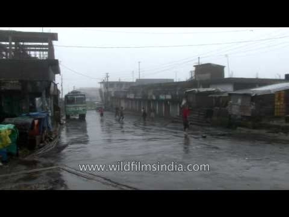 Children make rain-drenched roads of Cherrapunji their football ground