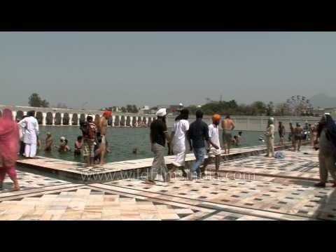 Pilgrims taking a dip in the holy sarovar at Anandpur Sahib