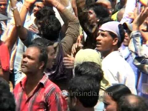 Indian Hindu devotees dance at the Jagannath Rath Yatra procession, Puri