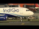 Indigo and Air India planes taxiing at Delhi airport