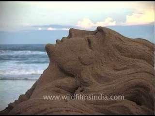 Abstract sand art of a woman in Puri Beach, Odisha