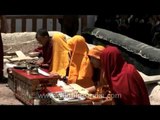Monks chanting prayers during a Buddhist religious ceremony in Leh