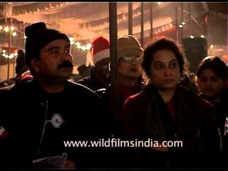 Catholic Priest giving away the Holy water on the eve of Christmas