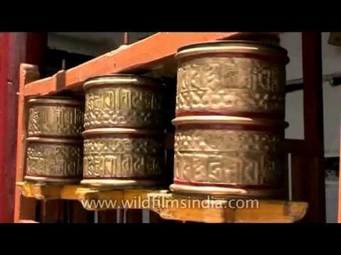 Buddhist prayer wheels spinning around in Leh, Ladakh