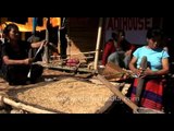 Adi women of Arunachal pounding corn and spinning cotton