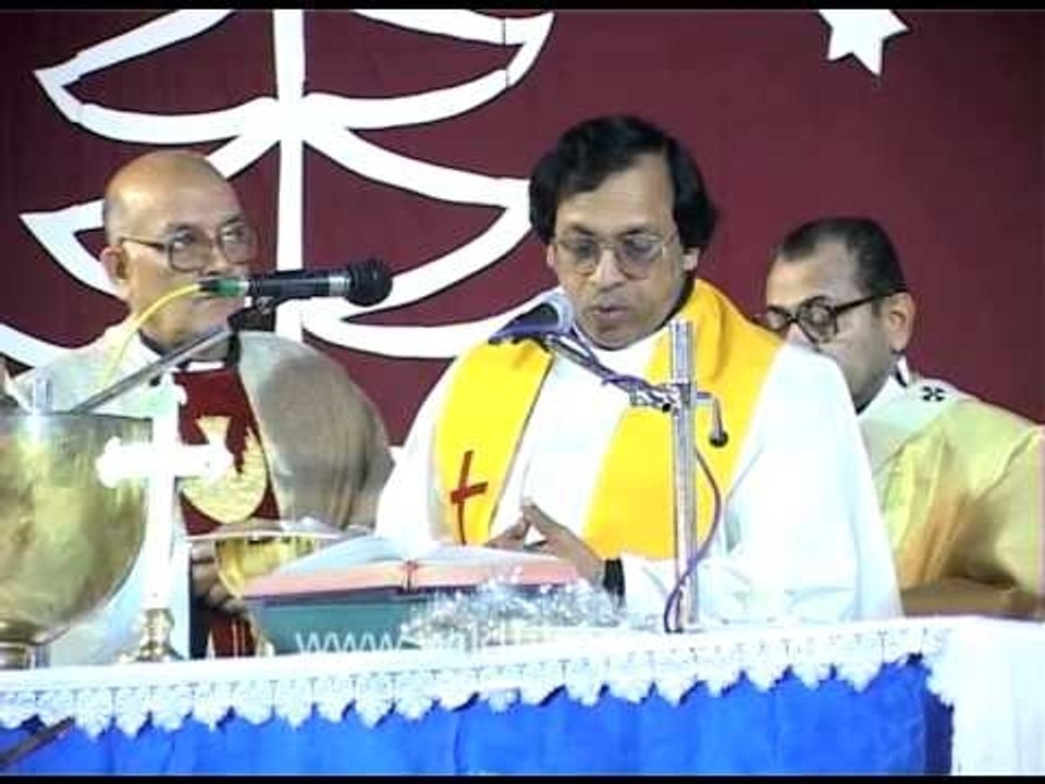 Christian priest praying to God before distributing the Lord's Supper