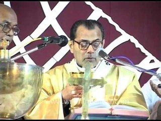 Christian priest reading the Bible before distributing Lord's supper