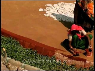 Decorating stage by applying rangoli : Indian art