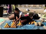 Girls and women sell oranges in Arunachal Pradesh