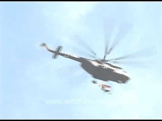 Army helicopter carrying the tri-colour Indian flag on R-day