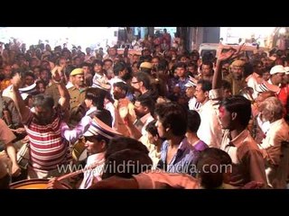 Boys operating super-noisy engine for portable chandeliers at the Mahashivratri procession, Varanasi