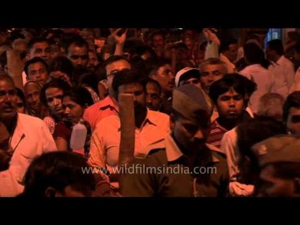 Policemen handling the pushing and jostling crowd of Mahashivratri  in Varanasi