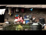 Woman washing utensils in the capital of Nepal- Kathmandu