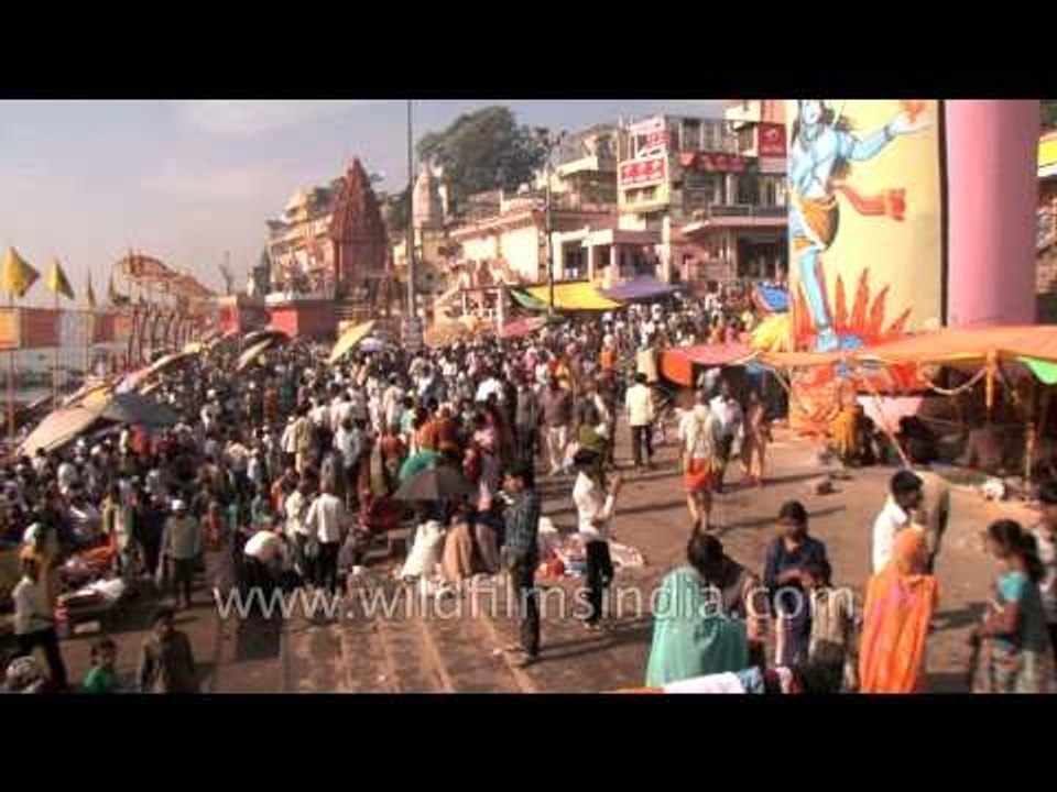 Devotees take a dip in the holy water of river...