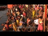 Devotees take ritual bath in Ganga river to mark the Shivratri festival, Varanasi