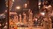 Hindu priests performing the Ganga Aarti as spectators watch in awe at Varanasi
