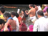 Devotees taking a spiritual bath in river Ganges during Mahashivaratri