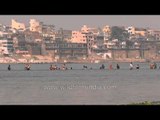 Across the Ganges in Varanasi: Sandy river banks and people immersing in spirituality!