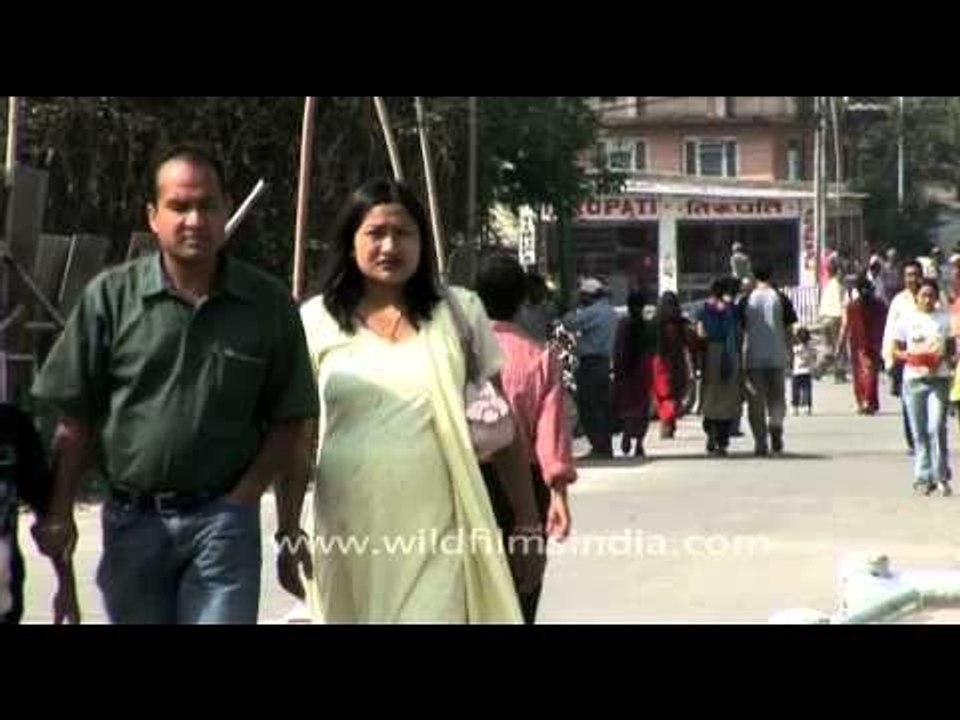 Nepali flower sellers chasing people to buy their product