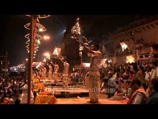 Evening Ganges aarti lamp held aloft, Varanasi