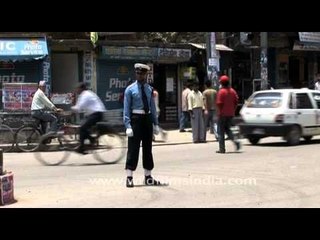 Traffic police of Nepal on traffic duty : why the chin strap?